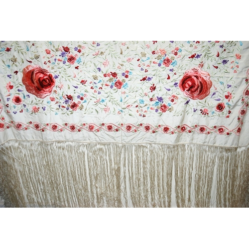 275 - A white silk embroidered piano shawl