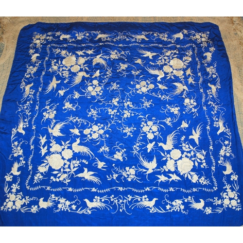 275 - A white silk embroidered piano shawl