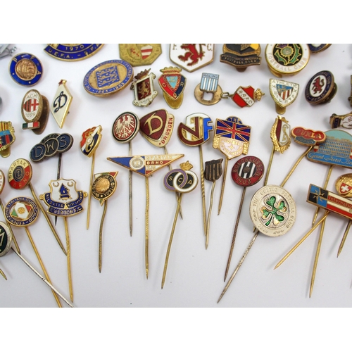 363 - A collection of football enamel lapel badges