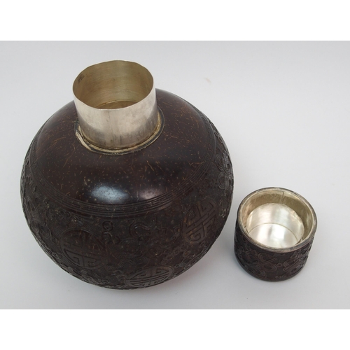 41 - A Chinese coconut and silver mounted set