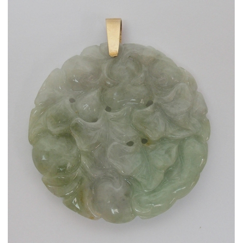 65 - A Chinese hard stone circular pendant