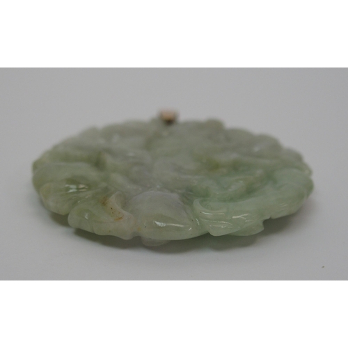 65 - A Chinese hard stone circular pendant