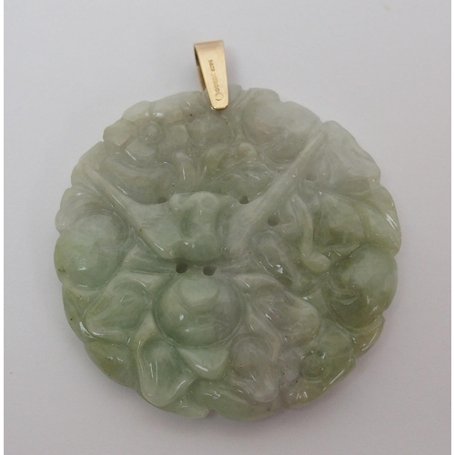 65 - A Chinese hard stone circular pendant