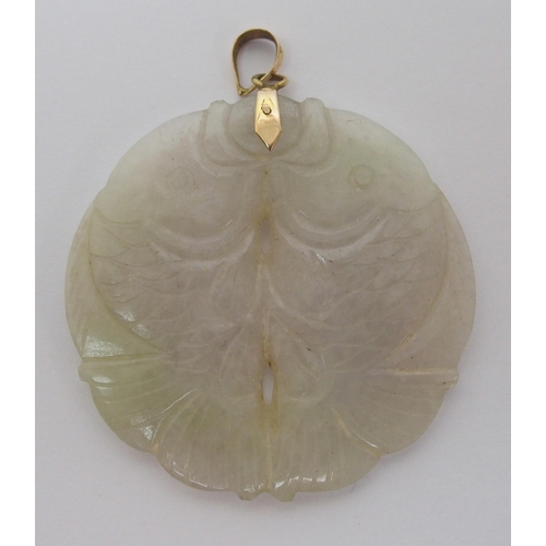 65 - A Chinese hard stone circular pendant