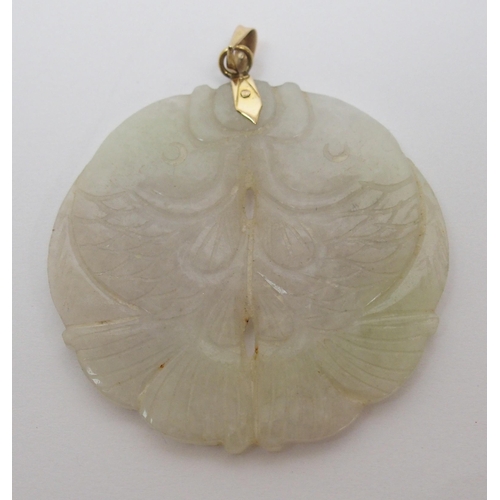 65 - A Chinese hard stone circular pendant