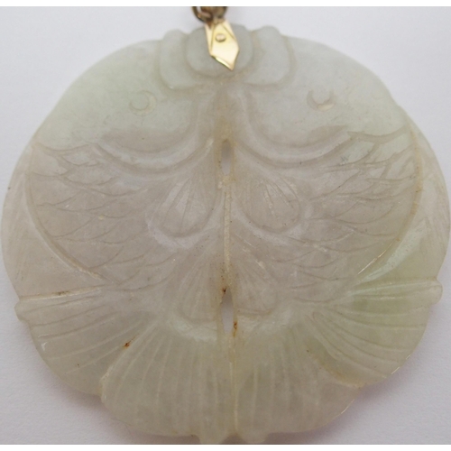 65 - A Chinese hard stone circular pendant