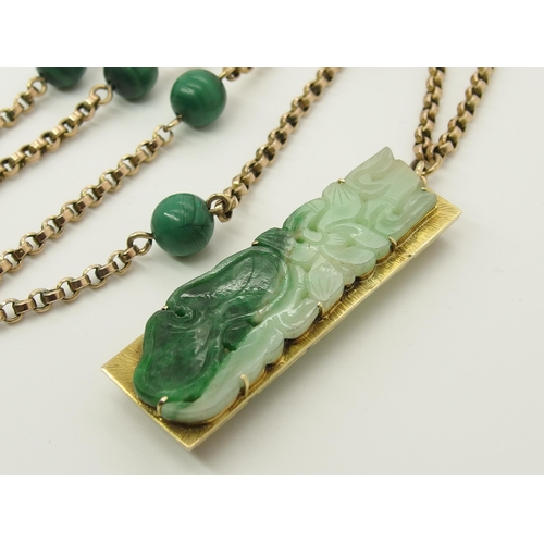 706 - A 14ct gold Chinese green hardstone pendant