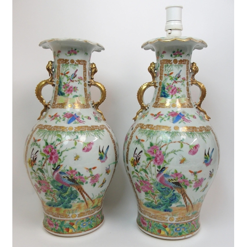 71 - A pair of Canton famille rose two handled vases