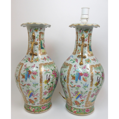 71 - A pair of Canton famille rose two handled vases