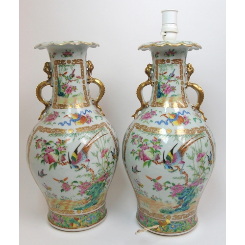 71 - A pair of Canton famille rose two handled vases