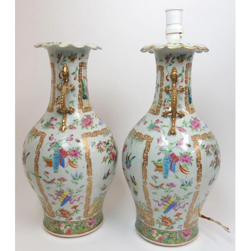 71 - A pair of Canton famille rose two handled vases