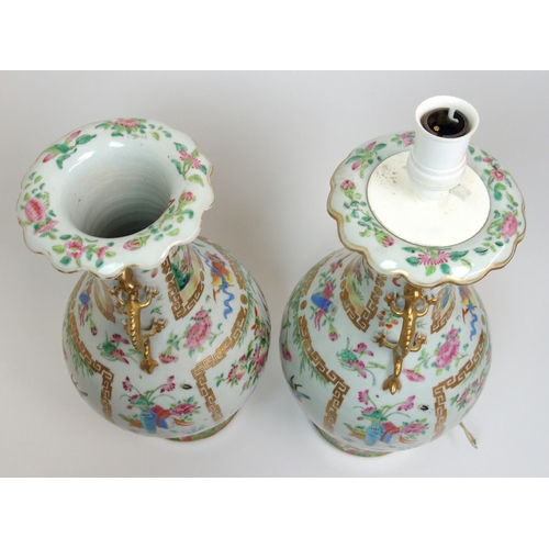 71 - A pair of Canton famille rose two handled vases