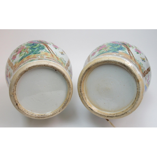 71 - A pair of Canton famille rose two handled vases