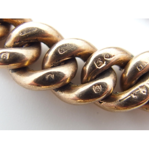 714 - A 9ct gold curb link fob chain