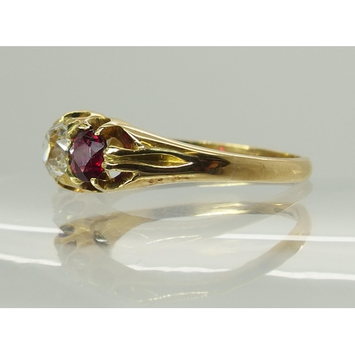 722 - A bright yellow metal ruby and diamond ring