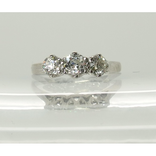 727 - An 18ct white gold three stone diamond ring