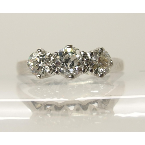 727 - An 18ct white gold three stone diamond ring