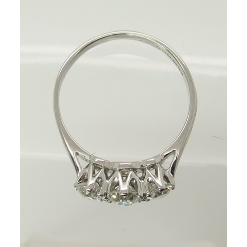 727 - An 18ct white gold three stone diamond ring