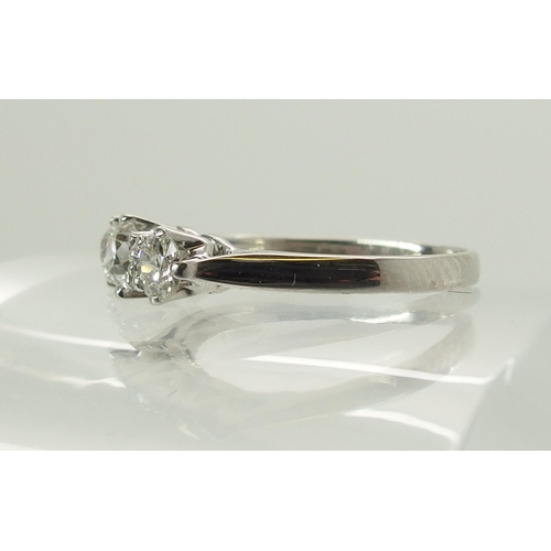 727 - An 18ct white gold three stone diamond ring