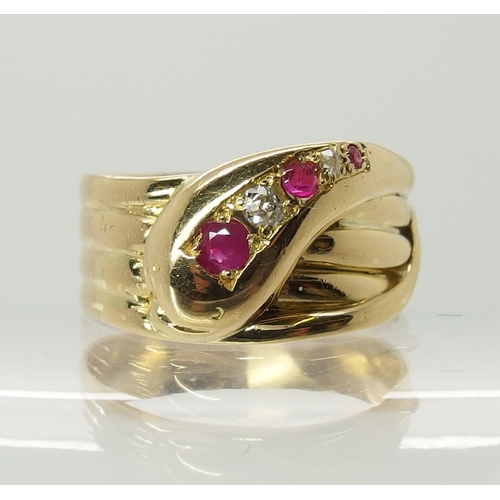 729 - An 18ct gold ruby and diamond set snake ring