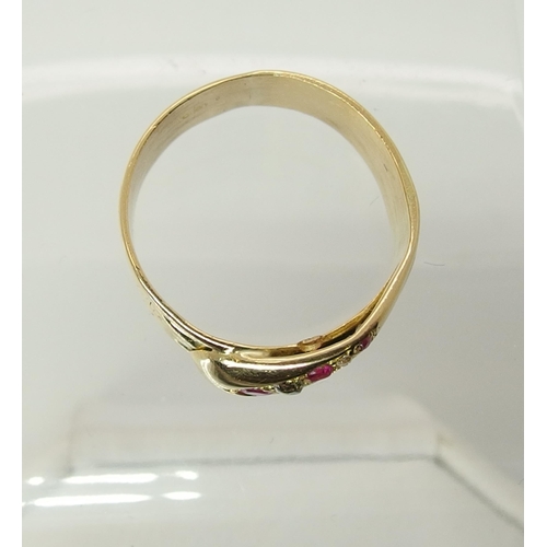 729 - An 18ct gold ruby and diamond set snake ring