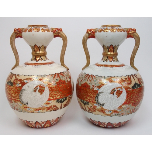 73 - A pair of Kutani two handled vases