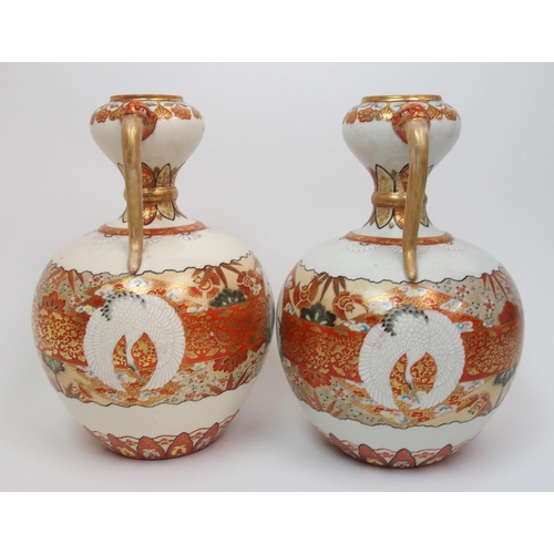 73 - A pair of Kutani two handled vases