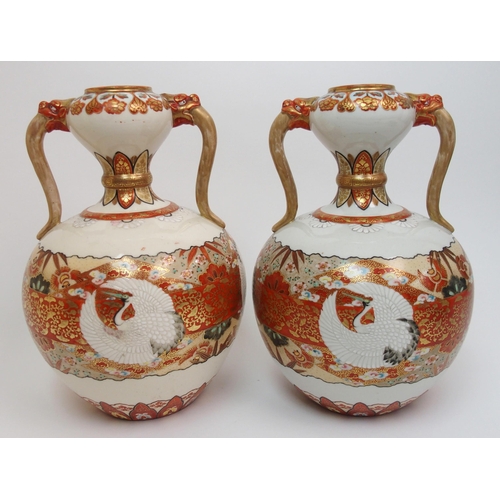 73 - A pair of Kutani two handled vases