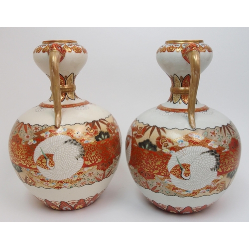 73 - A pair of Kutani two handled vases