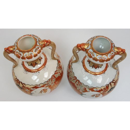 73 - A pair of Kutani two handled vases