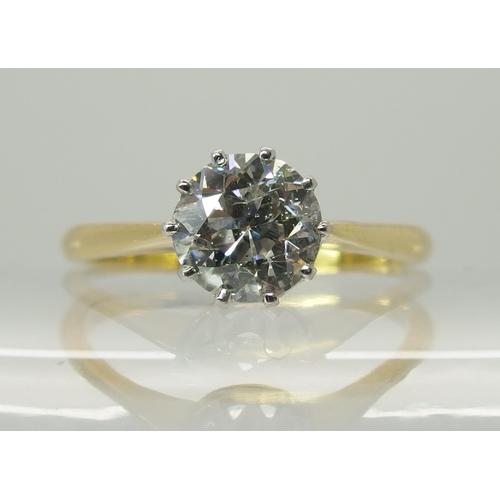 738 - An 18ct yellow and white gold diamond solitaire