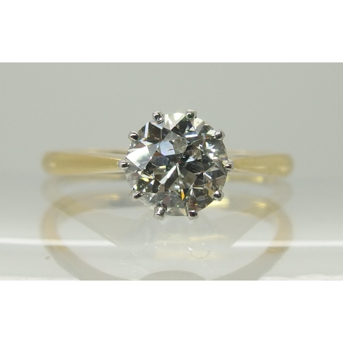 738 - An 18ct yellow and white gold diamond solitaire