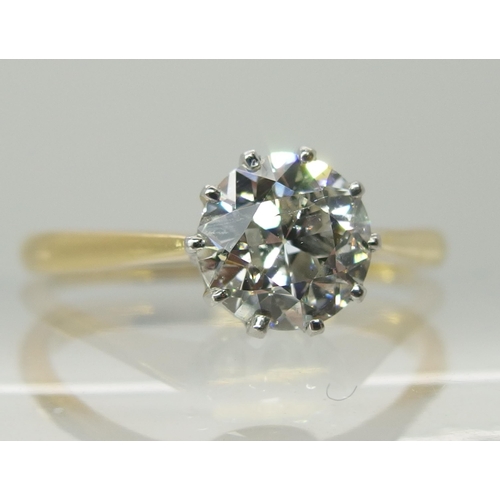 738 - An 18ct yellow and white gold diamond solitaire