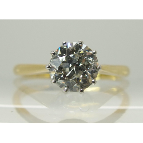 738 - An 18ct yellow and white gold diamond solitaire