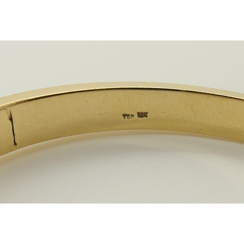 739 - An 18ct gold diamond set bangle