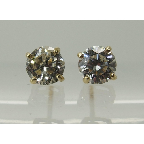 744 - A pair of 9ct yellow gold diamond stud earrings