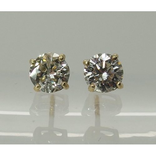 744 - A pair of 9ct yellow gold diamond stud earrings