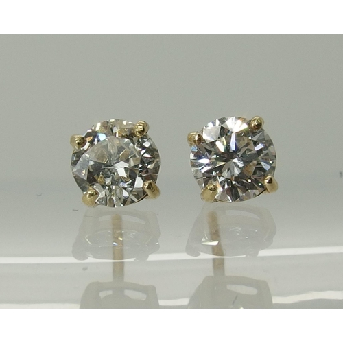 744 - A pair of 9ct yellow gold diamond stud earrings