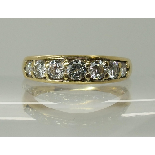 750 - An 18ct yellow gold seven stone diamond ring