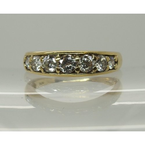 750 - An 18ct yellow gold seven stone diamond ring