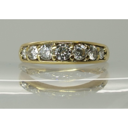 750 - An 18ct yellow gold seven stone diamond ring