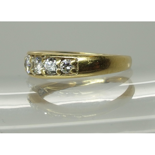 750 - An 18ct yellow gold seven stone diamond ring