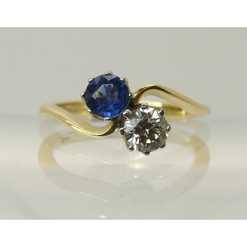 755 - An 18ct gold diamond and sapphire twin stone on a twist ring