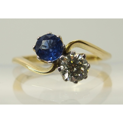 755 - An 18ct gold diamond and sapphire twin stone on a twist ring