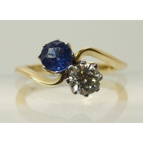 755 - An 18ct gold diamond and sapphire twin stone on a twist ring