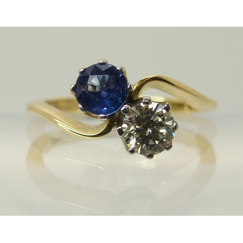 755 - An 18ct gold diamond and sapphire twin stone on a twist ring