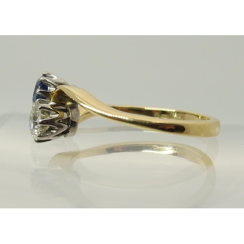 755 - An 18ct gold diamond and sapphire twin stone on a twist ring