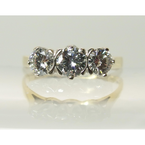 759 - An 18ct three stone diamond ring