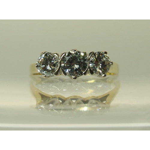 759 - An 18ct three stone diamond ring