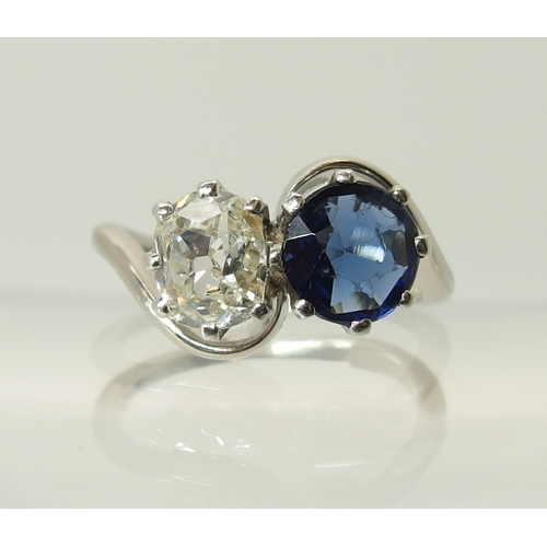 760 - An 18ct white gold and platinum diamond and blue gem twin stone ring